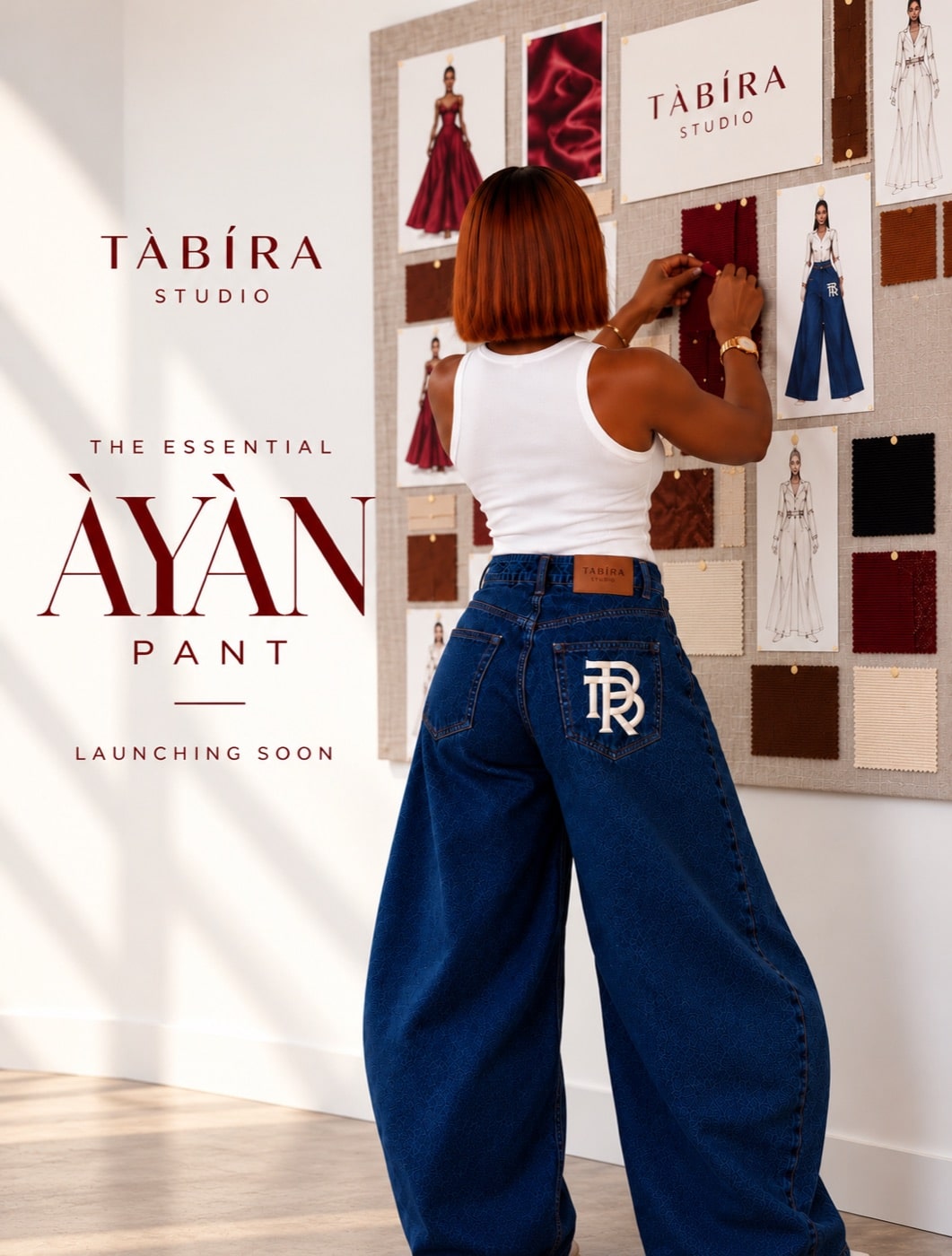 The Essential Àyàn Pant from TÀBÍRA Studio, wide-leg denim with the monogram on the back pocket